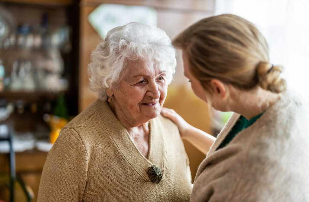 A woman talks to her elderly mother.