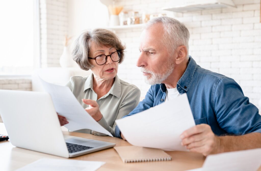 Mature couple reviewing documents.