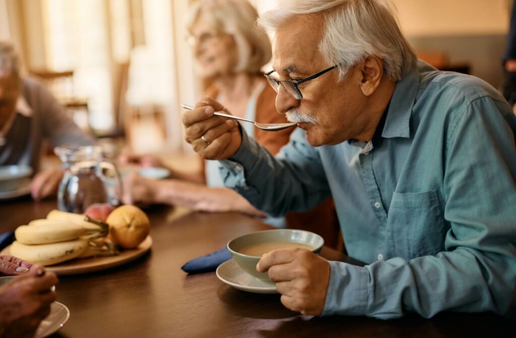 a senior is enjoying their chef-prepared soup in independent living