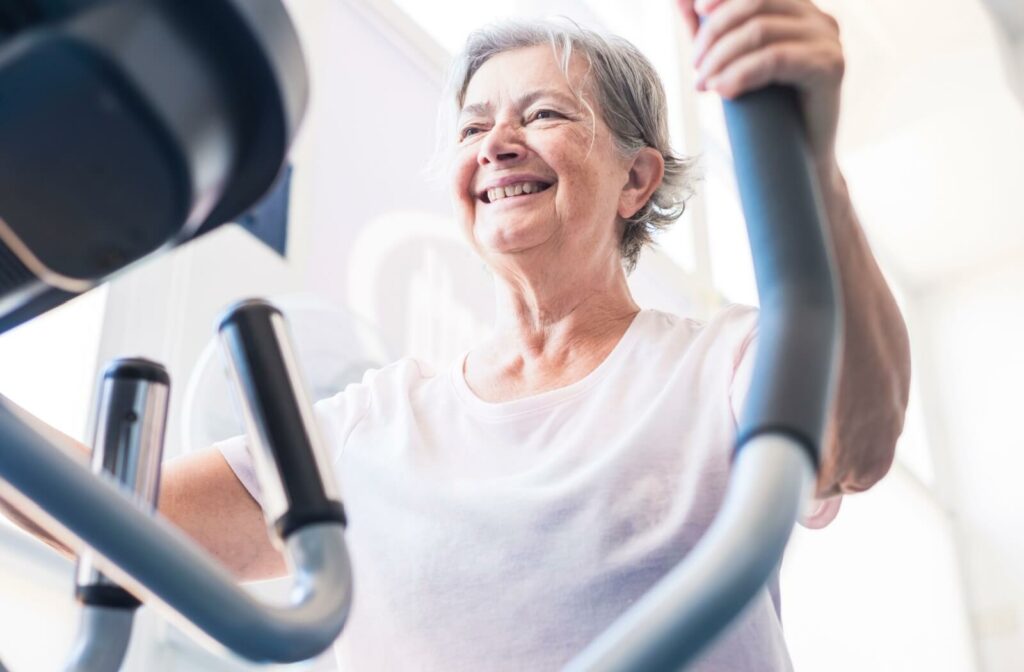 senior staying active on a exercise machine